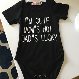 Black Baby Onesie - Moms Hot, Im cute, dads lucky!